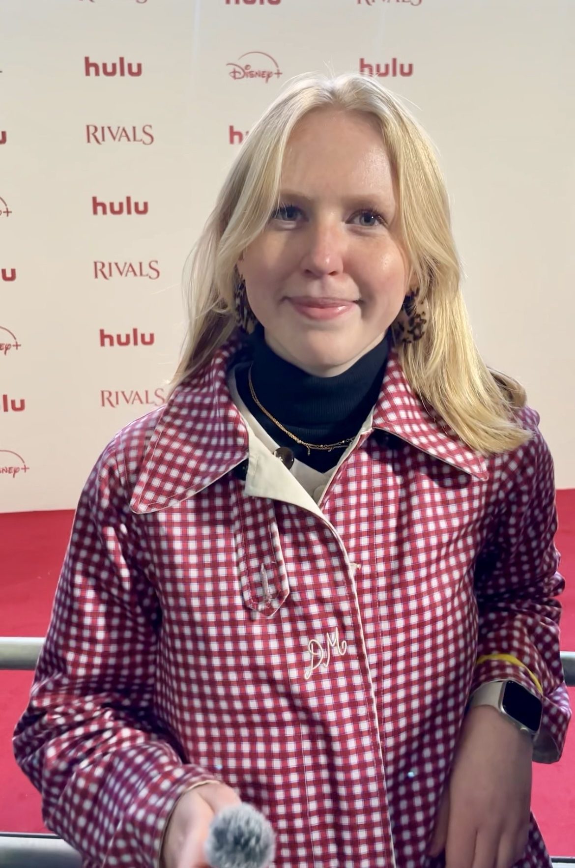 Olivia Emily on a red carpet at a TV premiere
